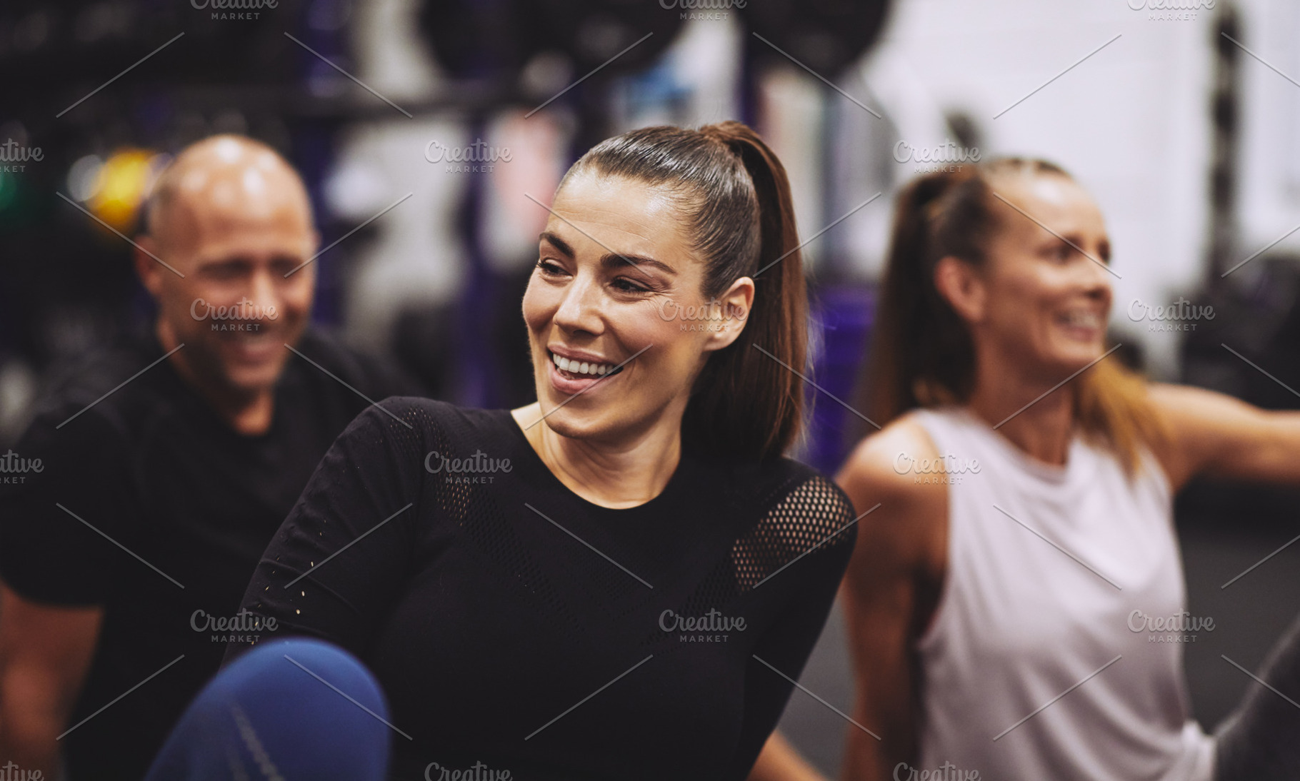 Laughing young woman relaxing after a gym class, a Sports & Recreation Photo by Stefan & Janni