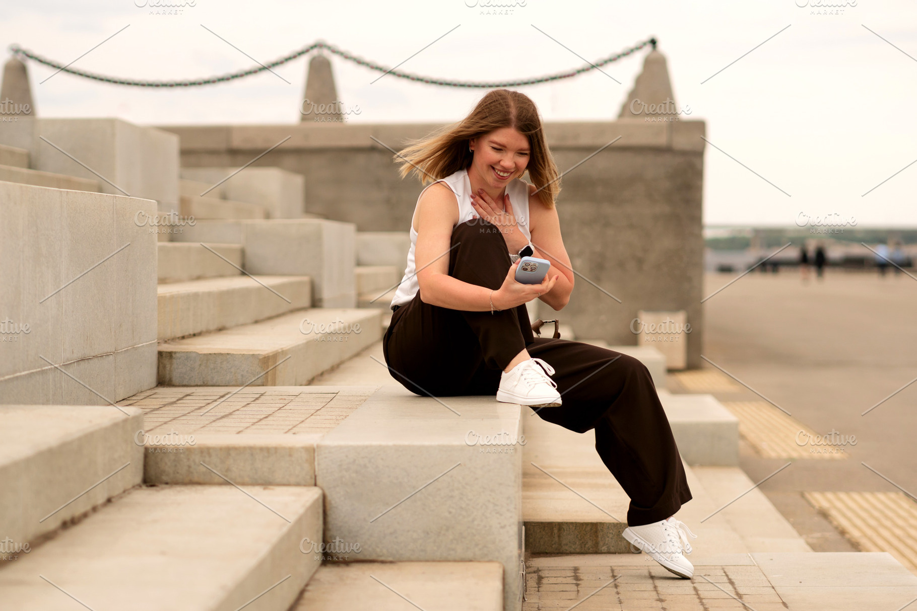 Young woman sitting on steps, a Person Photo by Elena Vagengeim