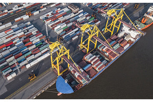Container ship unloading in port