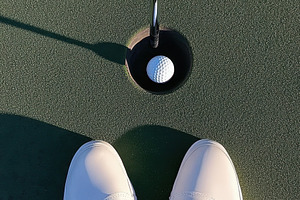 Golf ball by the hole, a Photo by Beautiful things