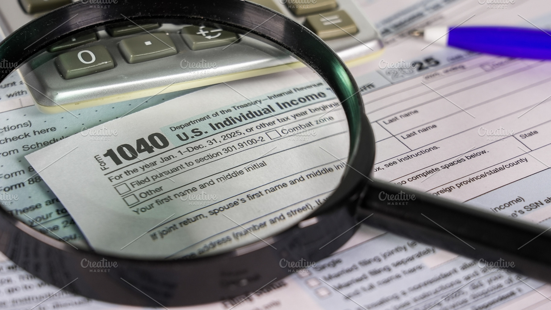 Tax form and calculator with a magni, a Photo by 1miromiro