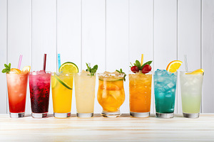 Different alcohol cocktails on wooden background, a Food & Drink Photo by AlyaAnd