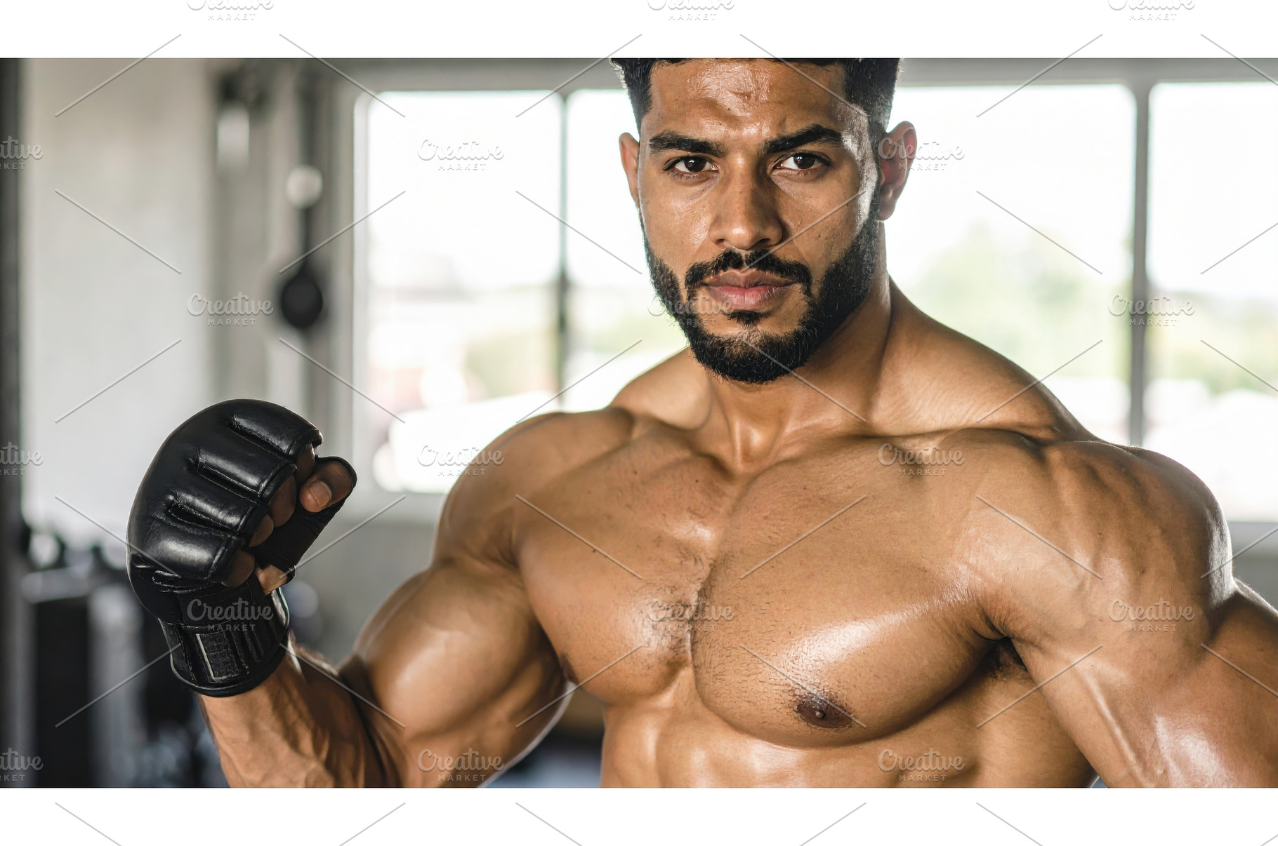 Male fighter posing shirtless with, a Sports & Recreation Photo by Igor Tichonow