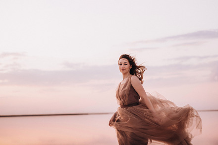 girl on the shore of a pink salt lake, a Person Photo by Weddings, People, Travel