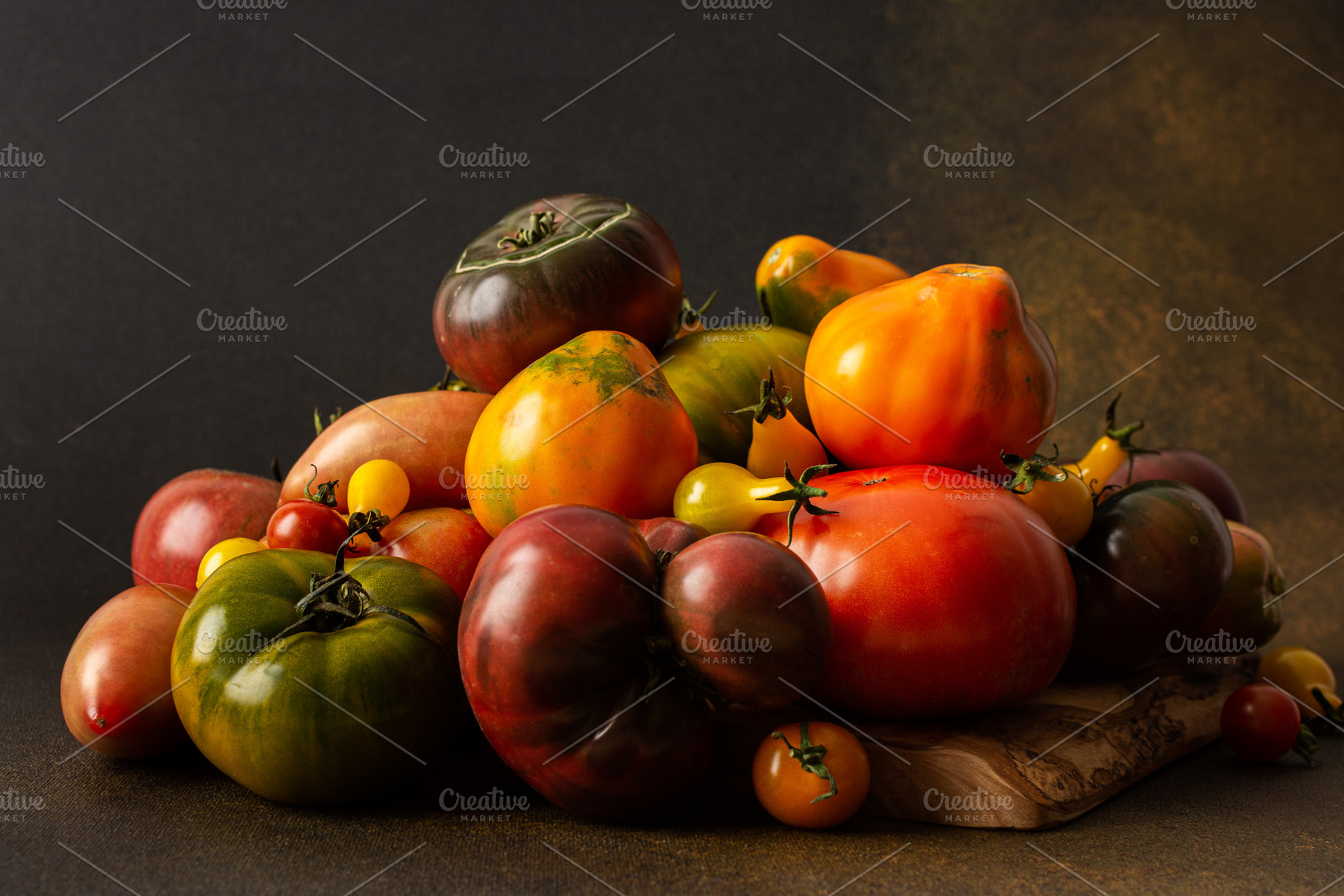 Tomatoes of different varieties, a Food & Drink Photo by Pandateam