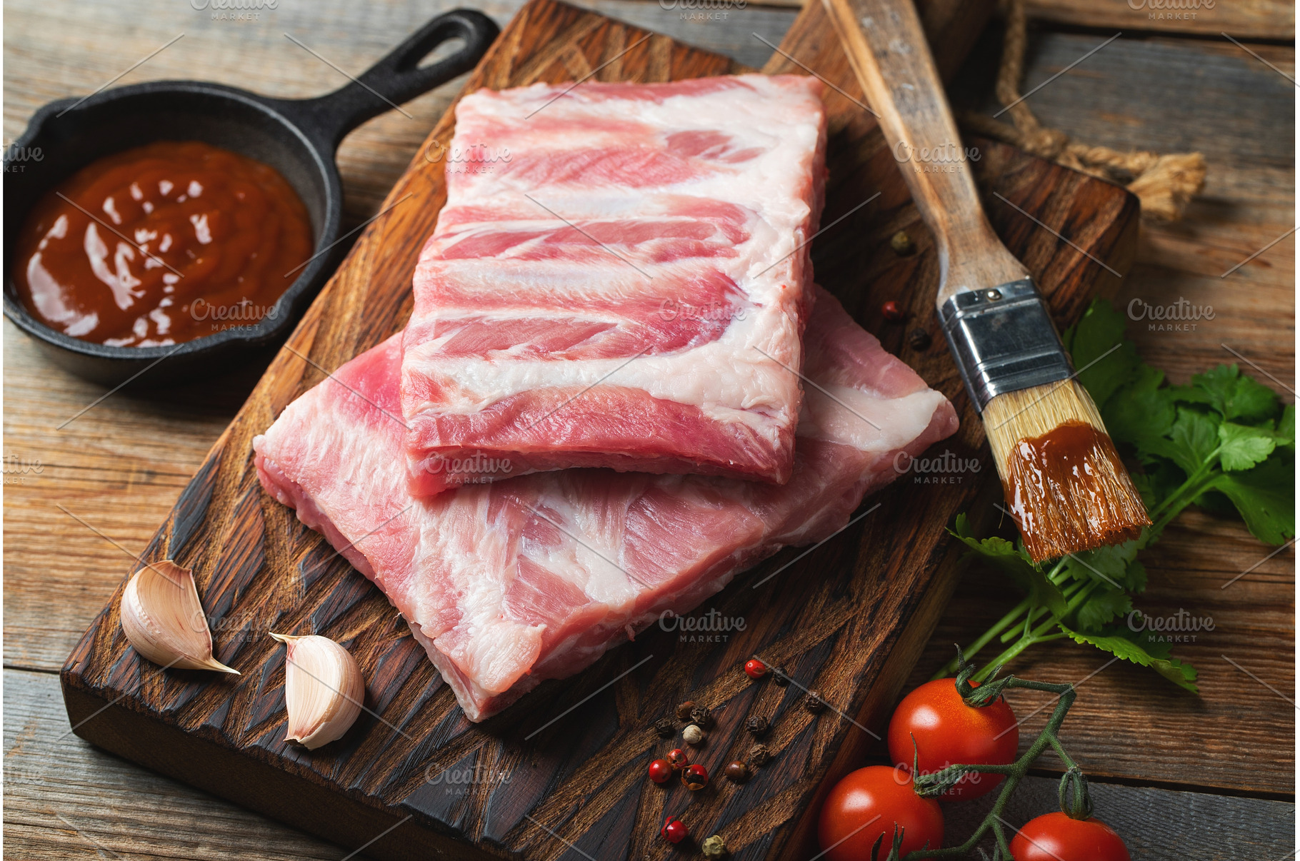 Raw pork ribs with spices, salt and, a Food & Drink Photo by Budarinphoto