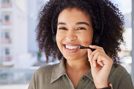Portrait, call center and black woman with smile, success and training for telemarketing, headset and customer service. Face, African American female employee and happy consultant for tech support, a Photo by Peopleimages.com
