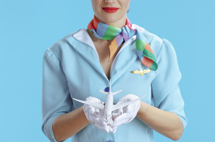 Closeup on stewardess woman on blue, a Business Photo by Alliance Images