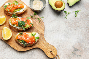 Smoked salmon toast with avocado and cream cheese, a Food & Drink Photo by Olena Rudo