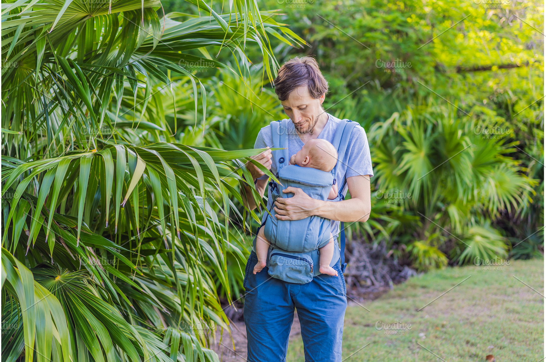 Young father walks in nature with, a Person Photo by Elizaveta Galitskaya