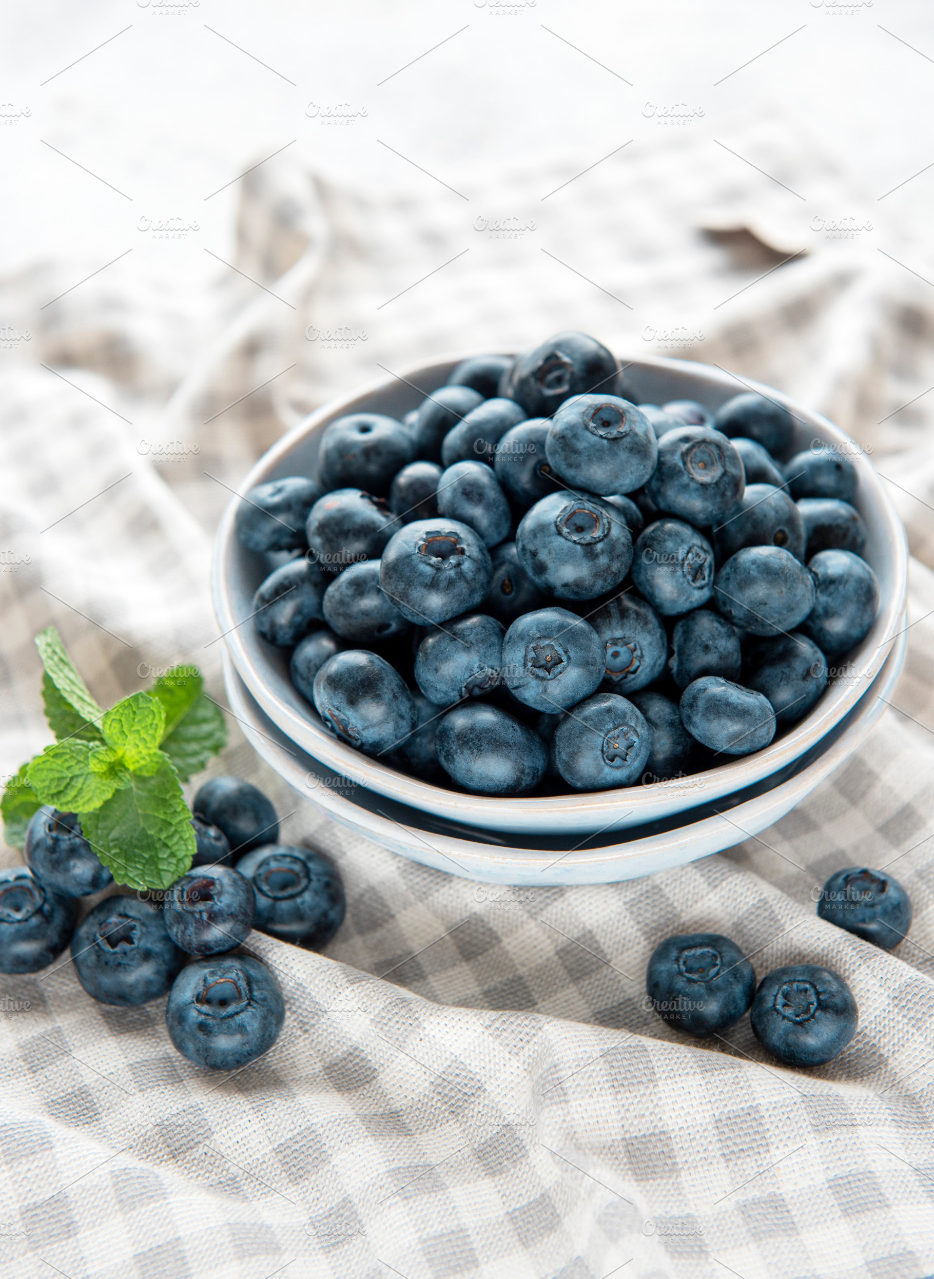 Blueberries on textile background, a Food & Drink Photo by Olena Rudo