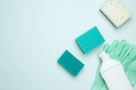 Concept of cleanliness and hygiene. Cleaning supplies and tools, including bott, a Photo by matucha