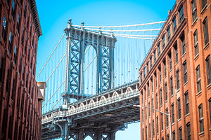 Manhattan bridge between buildings stock photo containing ny and nyc
