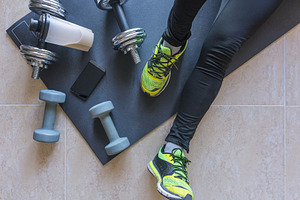 Dumbbell and mat training at home stock photo containing active and activity
