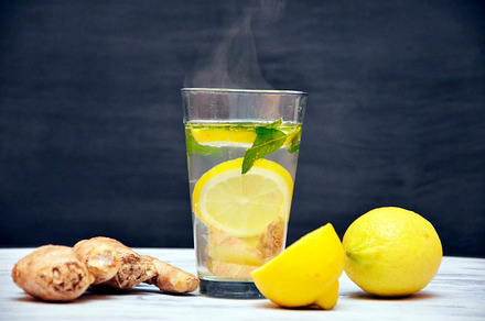 Ginger tea with lemon on a wooden background containing background, medical, a Health & Medical Photo by velychko.ua