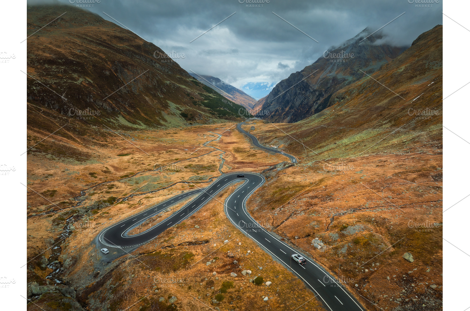 Aerial view of winding road in high, a Transportation Photo by den-belitsky
