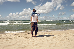 Rear view of woman on the beach, a Person Photo by BOOCYS