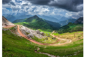 Winding mountain road in a vibrant, a Nature Photo by den-belitsky