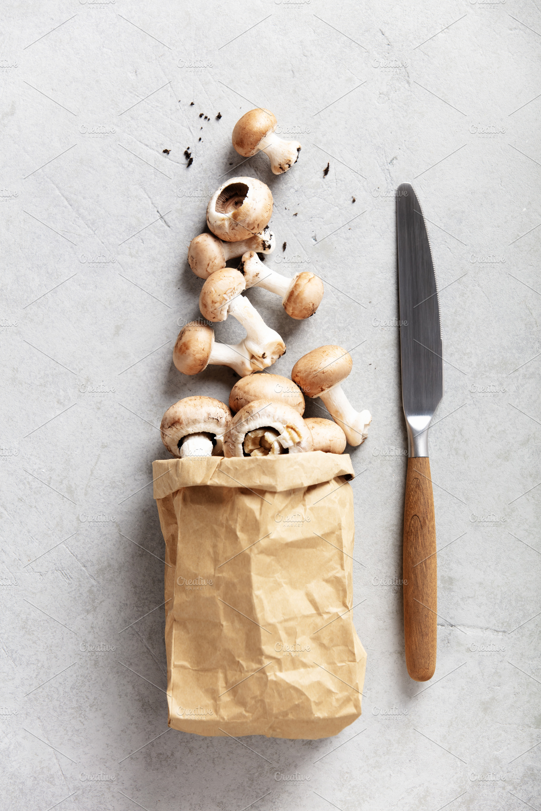 Fresh Brown Mushrooms in a Paper Bag on Light Stone Background, a Food & Drink Photo by Natalia Klenova's Shop