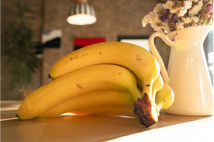 Bunch of bananas lying on the wooden, a Food & Drink Photo by oksix