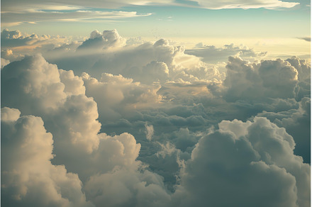 Aerial view of fluffy cumulus clouds, a Nature Photo by Ylivdesign