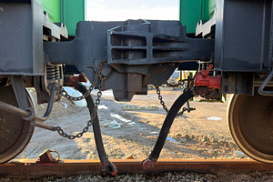 Close-up view of train couplings and wheels, showcasing mechanical components a, an Industrial Photo by Textures & Backgrounds
