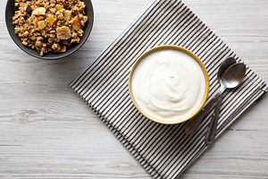 Organic Whole Fat Greek Yogurt in a Bowl, top view., a Food & Drink Photo by LiudmylaChuhunova