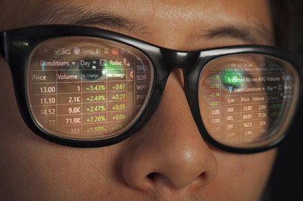 Close up of an Asian eyes of a man, glasses with digital graph c, a Photo by Tampatra