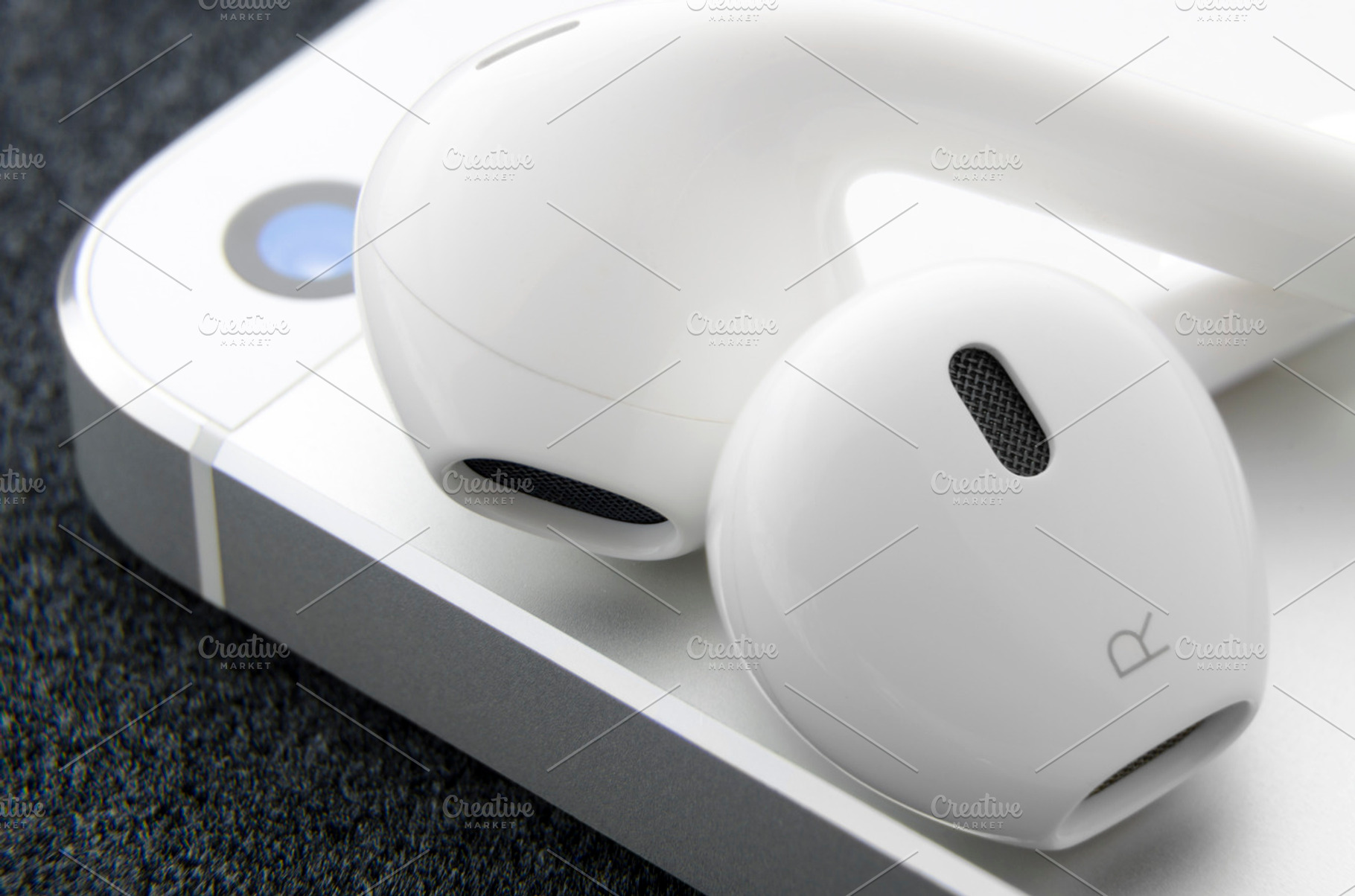 White headphones on smartphone, a Technology Photo by Juicy Photography