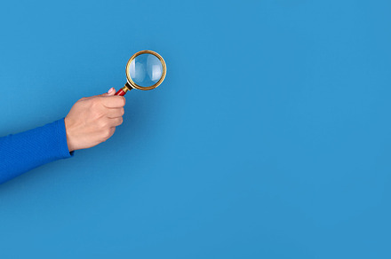 magnifier in hand panoramic, a Business Photo by Ales Munt