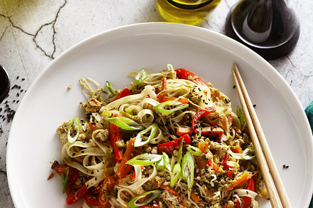 vegan pad thai rice pasta with vegetables and tofu on gray concr, a Food & Drink Photo by IriGri