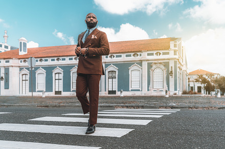 Black businessman on a crosswalk, a Person Photo by SkyNext