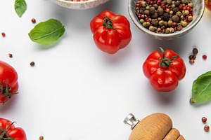 Fresh tomatoes with pink salt and peppercorns for cooking, a Food & Drink Photo by Olena Rudo