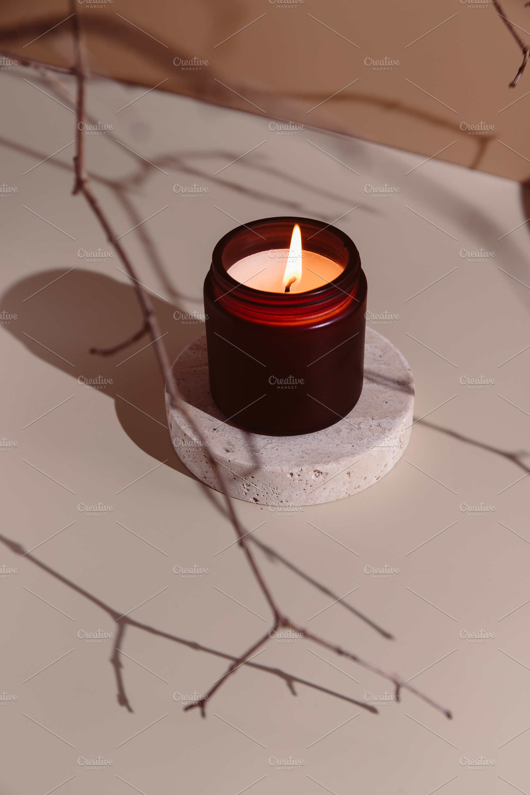 Minimalistic burning candle in a dar, a Photo by Edalin's Store