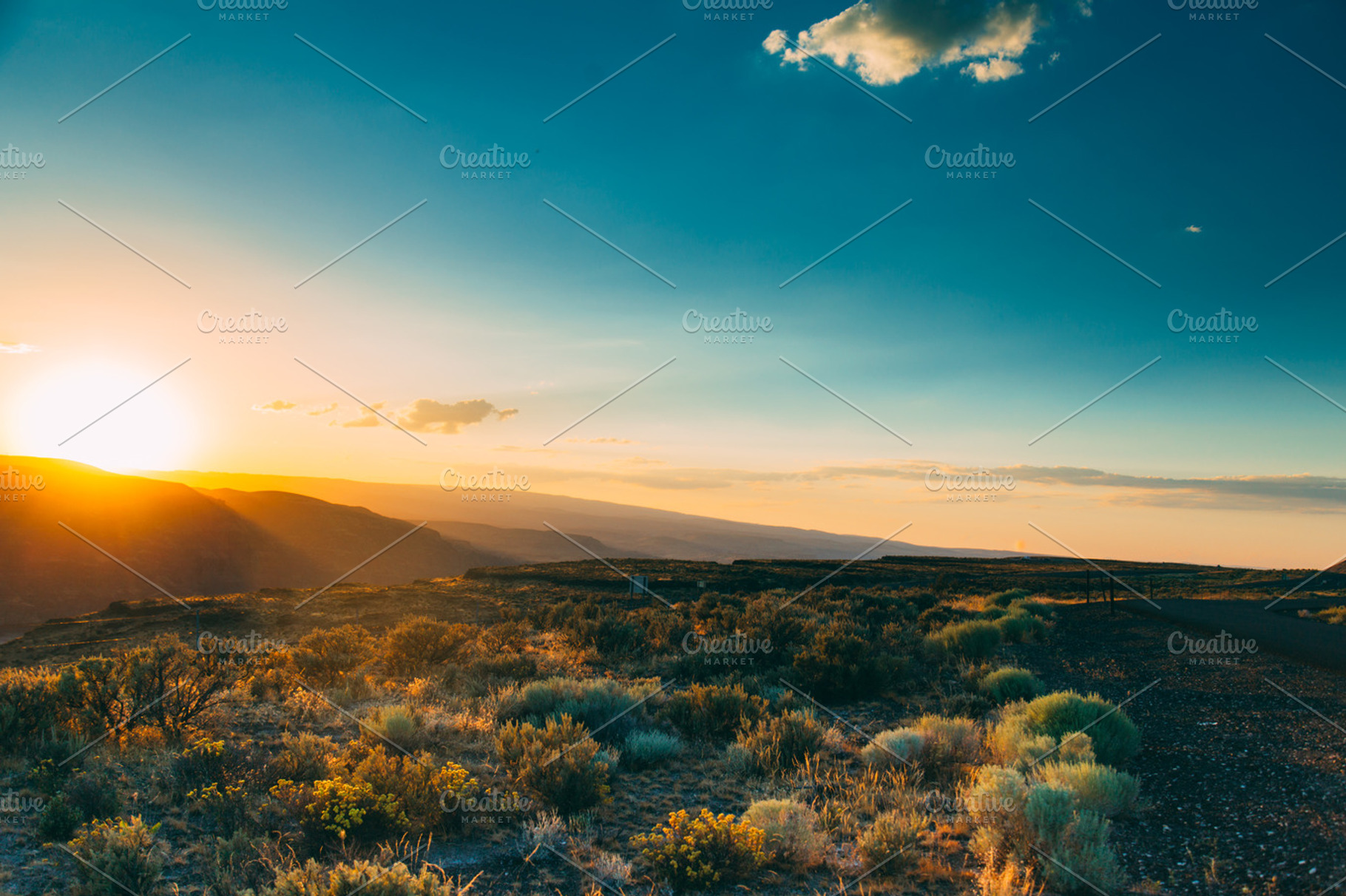 Sunset over the mountains stock photo containing sunset and mountains, a Nature Photo by Hello Goodbye Studio