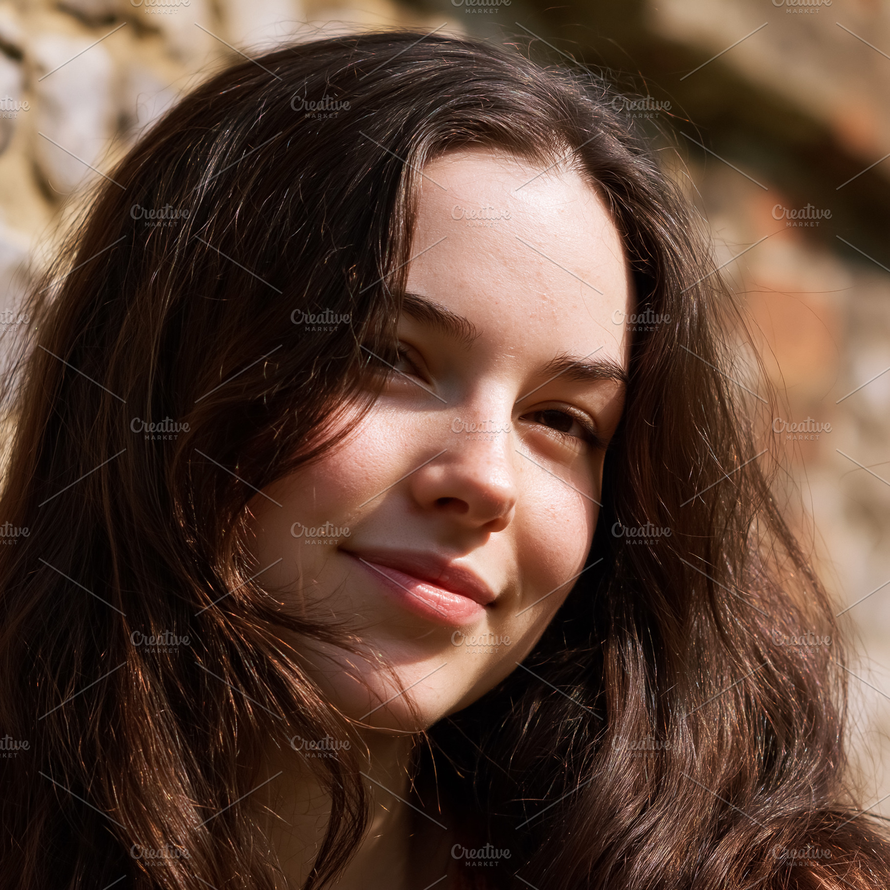 Young woman smiling with brown long hair feeling happiness in na, a Person Photo by Studio ANNA