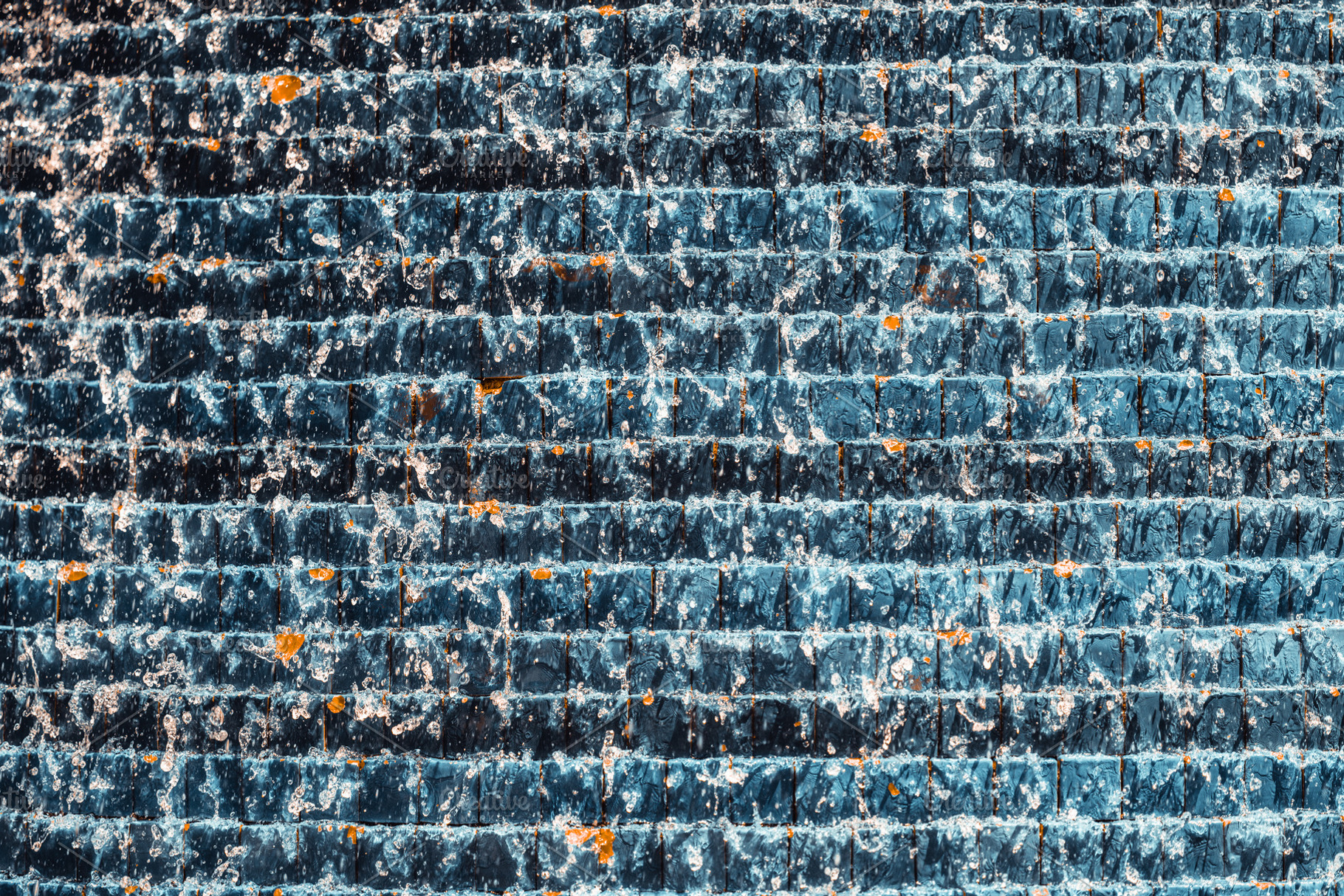Water Cascading Over Blue Tiles, a Background Photo by SkyNext