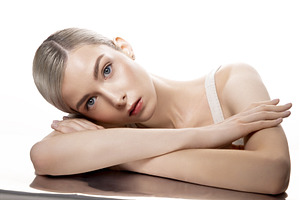 A woman is lying on a table with her
