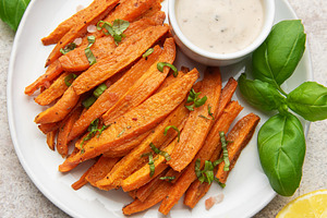 Sweet potato fries with dipping sauce and lemon, a Food & Drink Photo by Olena Rudo