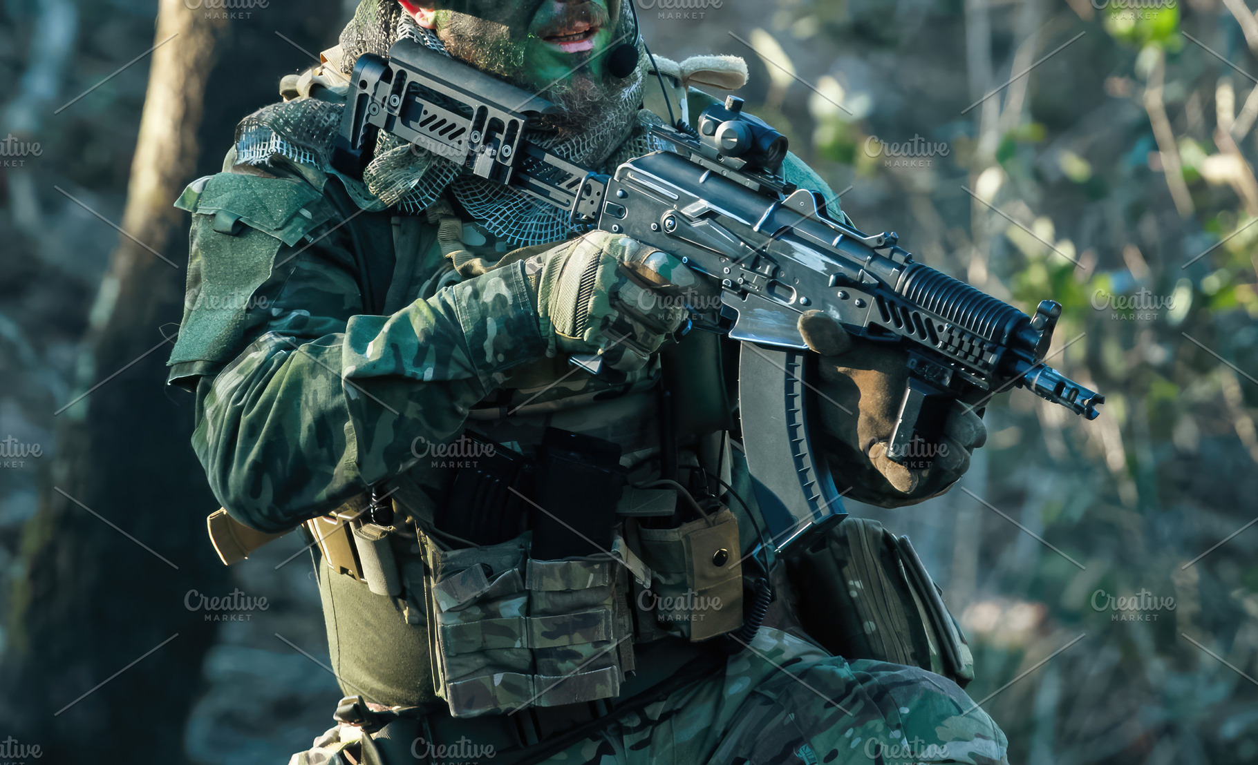 Soldier aiming with airsoft gun during military training exercise in forest, a Sports & Recreation Photo by Antonio Gravante Market
