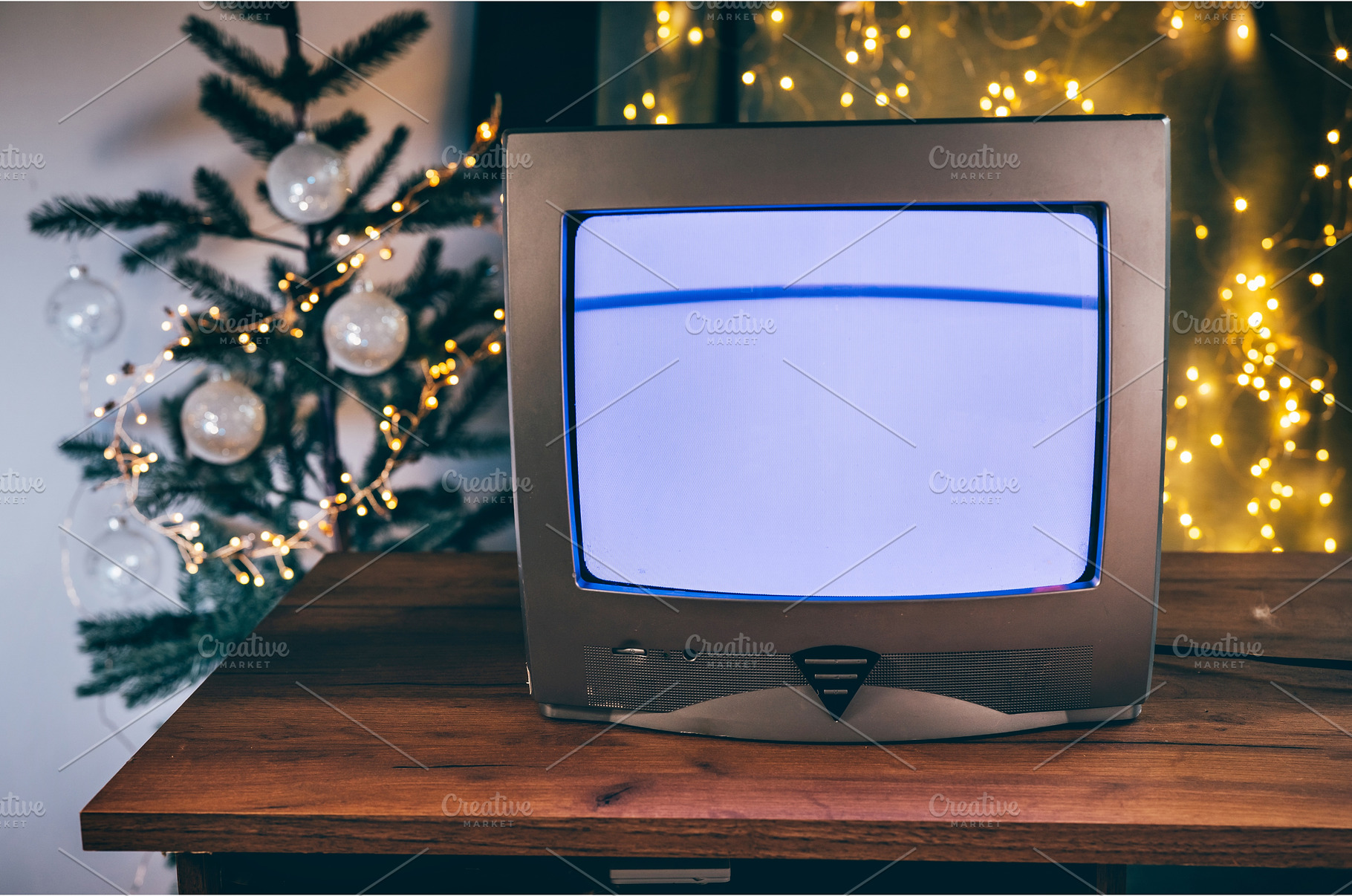 Old TV set in a room with Christmas, a Holiday Photo by Yummypic
