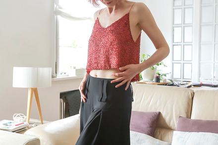 A Red-haired woman in fashion clothes standing at home, a Person Photo by RF Images