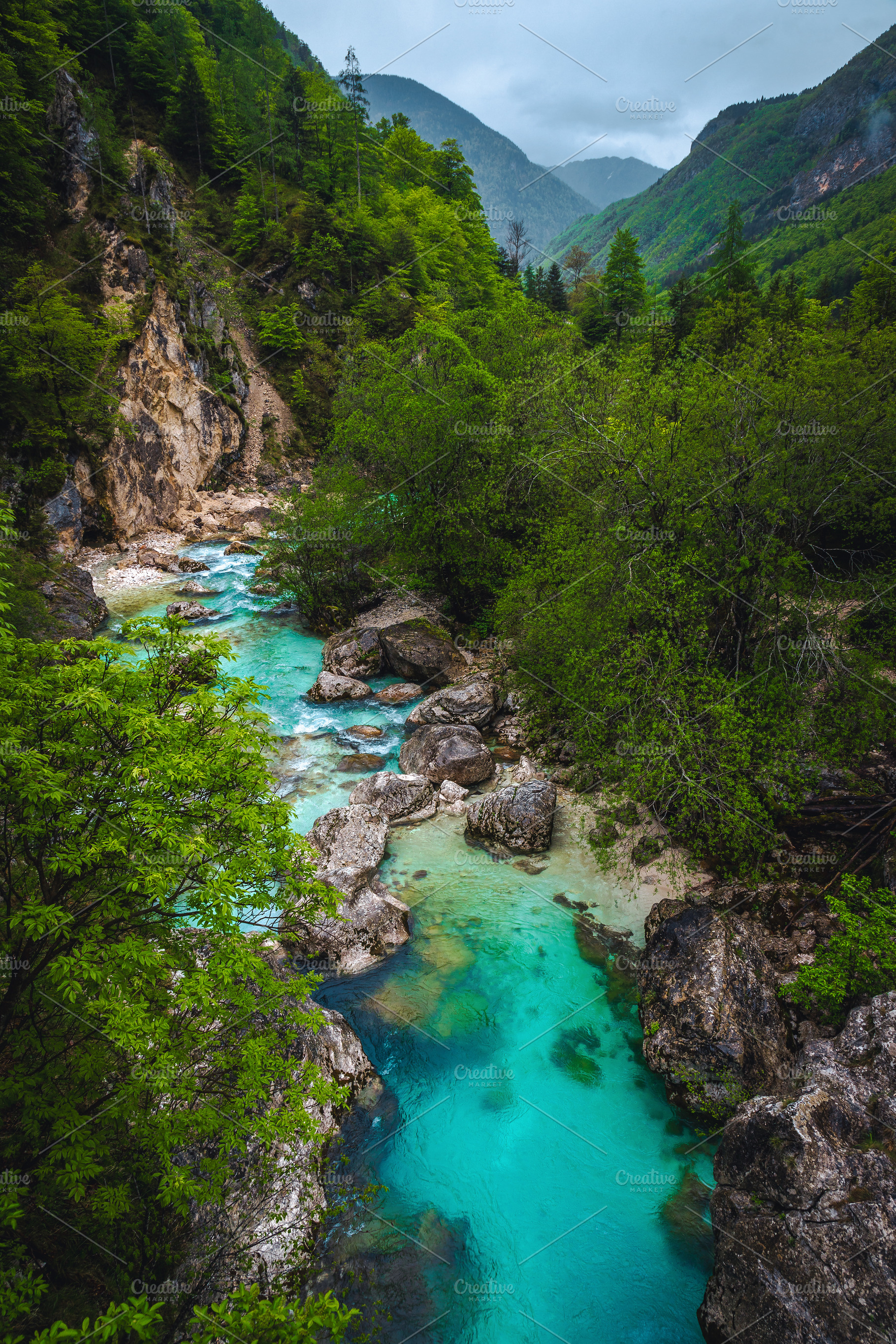 Soca river with rocky shoreline, a Nature Photo by Alpine Dreams