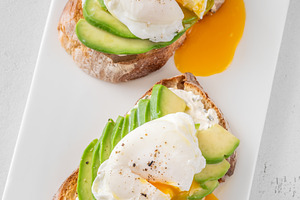 Avocado toast with poached eggs, a Food & Drink Photo by Alexander Prokopenko