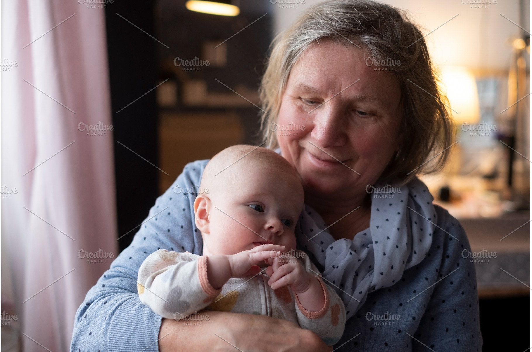 Elderly woman grandmother holding a, a Person Photo by Koldunova