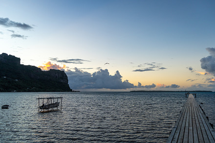 Sunset over the tranquil lagoon of Maupiti, French Polynesia, a Nature Photo by GoodGoods