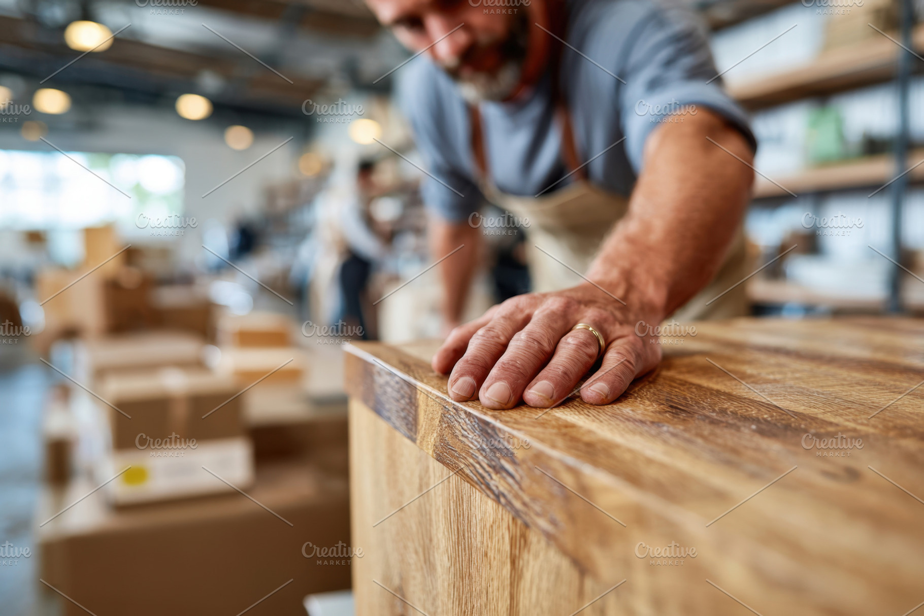 Craftsman working on wooden planks in workshop, an Industrial Photo by AlyaAnd