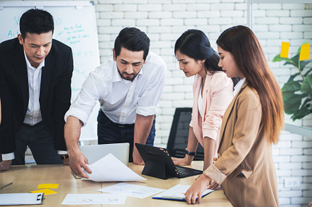 Successful business group working at the office, a Business Photo by Nednapa