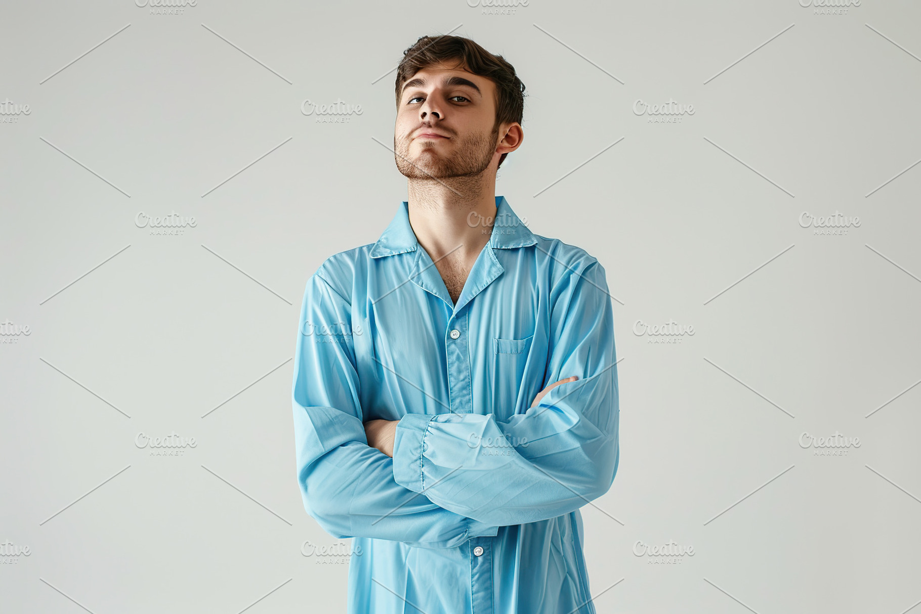 Young attractive boy in pajama on grey background, a Person Photo by AlyaAnd