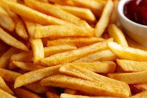Homemade Golden French Fries with Ketchup, side view. Close-up., a Food & Drink Photo by LiudmylaChuhunova